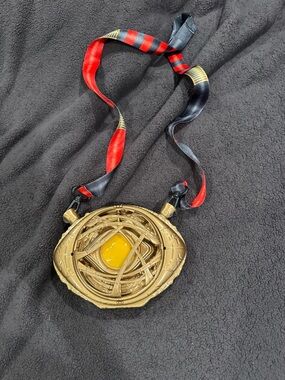 Disney Gold-Tone Pendant Necklace with Yellow Center and Red-Black Ribbon
